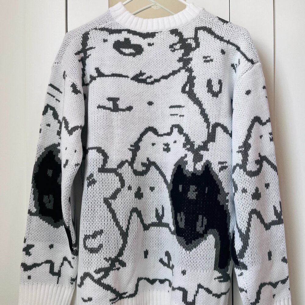 Black and white knitted cat sweater